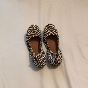 Black and white slip ons